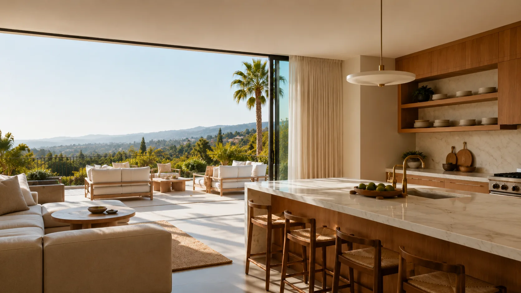 Open-concept kitchen and living room with a white marble waterfall island, white oak cabinetry, and a hillside canyon view through open floor-to-ceiling glass doors